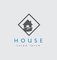 Grey House with blue text