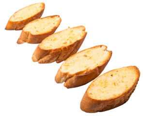 Homemade garlic bread of French baguette over white background