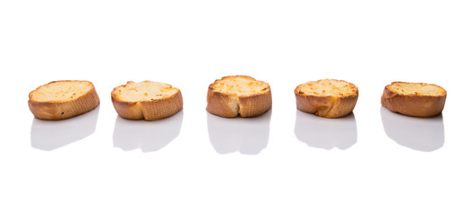 Homemade garlic bread of French baguette over white background