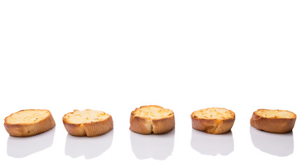 Homemade garlic bread of French baguette over white background