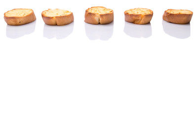 Homemade garlic bread of French baguette over white background