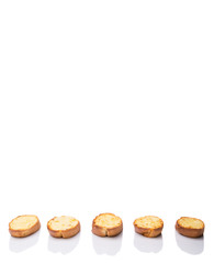 Homemade garlic bread of French baguette over white background
