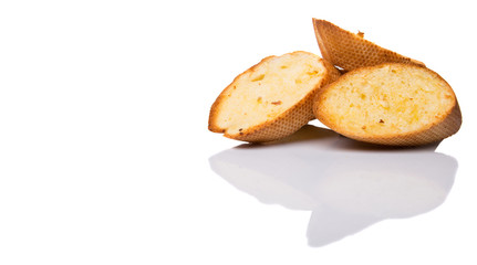 Homemade garlic bread of French baguette over white background