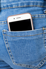 Cell phone in back pocket of girl's jeans