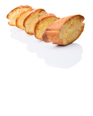 Homemade garlic bread of French baguette over white background