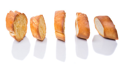 Homemade garlic bread of French baguette over white background