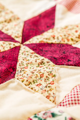 Handmade.  patchwork quilt as background. 