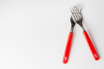 two forks positioned as praying hands