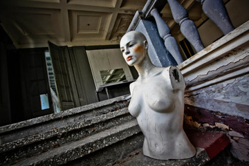 Beautiful mannequin in abandoned store