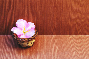 artificial flower in small basket