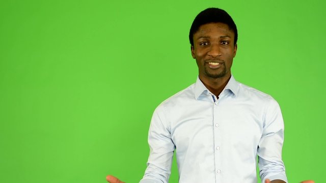 young handsome black man talk - green screen