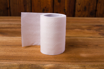 Toilet paper on a wooden table