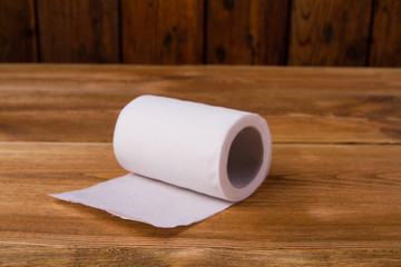 Toilet paper on a wooden table