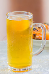 Glass with beer on table