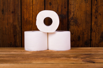 Toilet paper on a wooden table