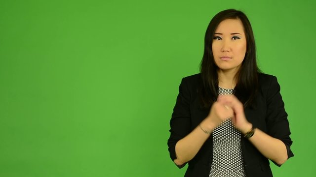 asian woman do not understand - green screen