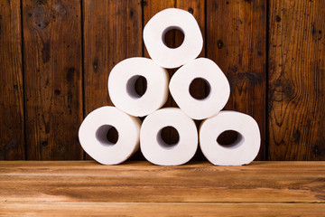 Toilet paper on a wooden table