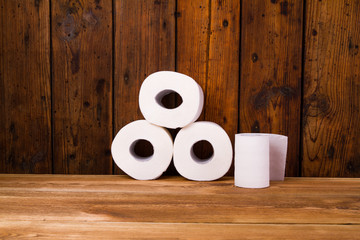 Toilet paper on a wooden table