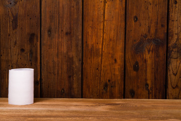 Toilet paper on a wooden table