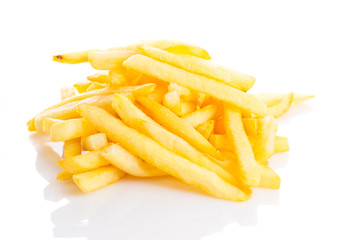a pile of appetizing french fries isolated on a white background