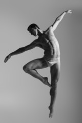 Dance freedom concept. Young handsome ballet man in fly grace po - obrazy, fototapety, plakaty