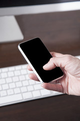 blank screen smartphone over computer