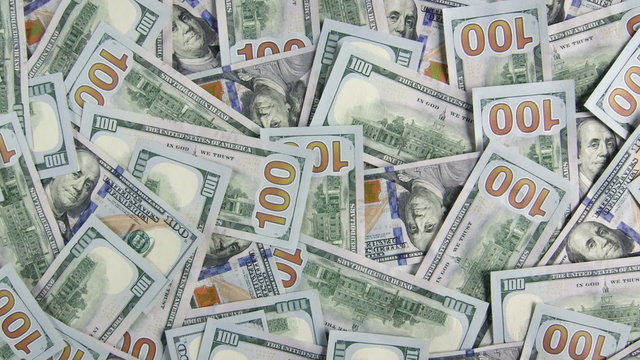 Lot of $100 american dollar bills closeup background