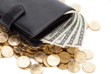 Black leather wallet with dollars and golden coins on white