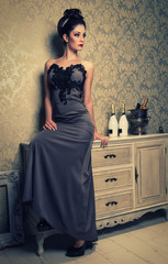 sexy brunette woman in an elegant dress