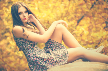 Naklejka premium beautiful girl sitting on a tube