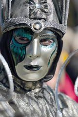 Silver and emerald mask at the Carnival of Venice