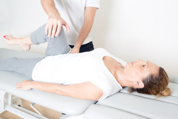 Chiropractic care with elderly woman
