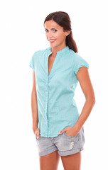 Obraz premium Fashionable lady in short jeans looking at you