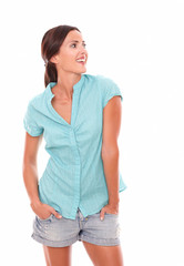 Obraz premium Happy woman in short jeans looking to her left