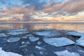Winter Sea landscape with big ice fragments on water