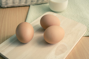 Close up of eggs on wooden table