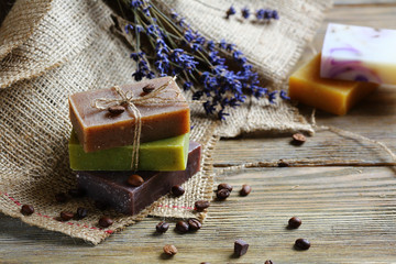 Handmade soap on wooden boards with coffee beans