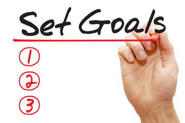 Hand writing Set Goals List with red marker, business concept