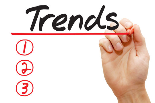 Hand writing Trends List with red marker, business concept