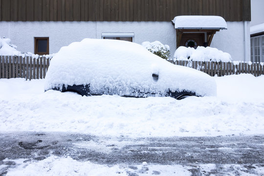 Car Covered In Snow