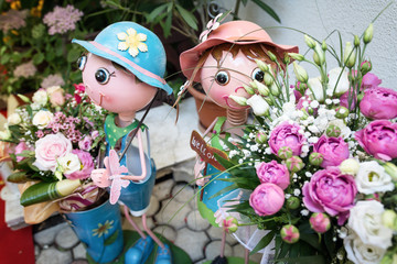 puppets holding flowers