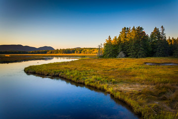Fototapeta na wymiar Evening light on a stream and mountains near Tremont, in Acadia