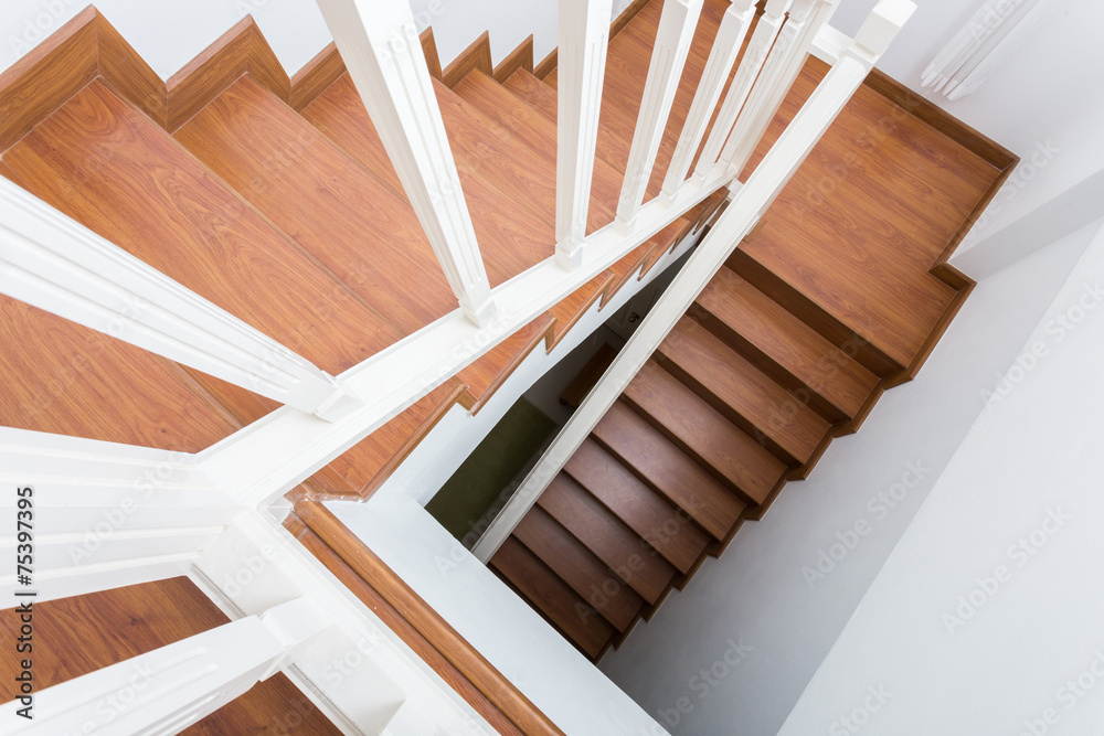 Wall mural wooden staircase made from laminate wood in white modern house