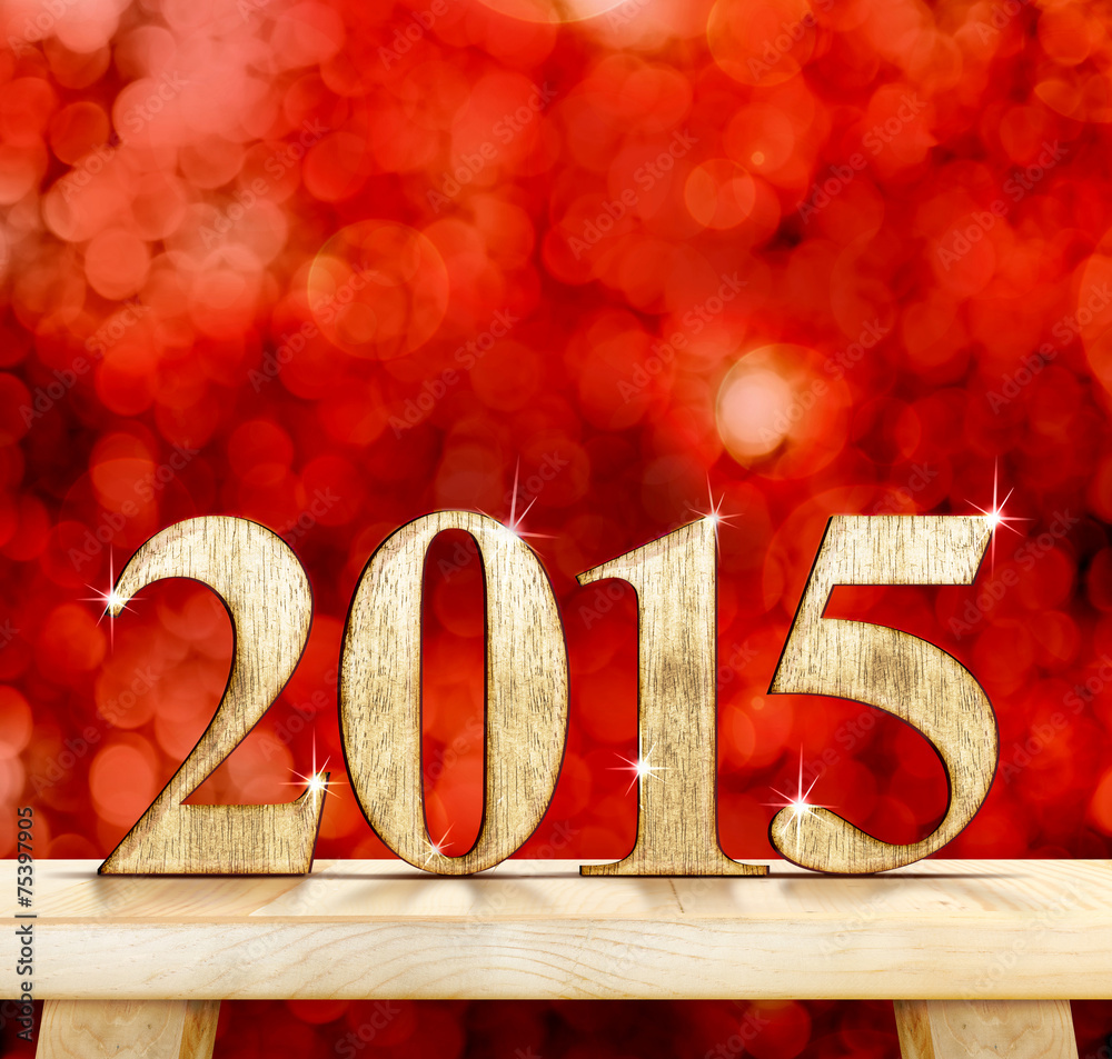 Poster 2015 year number on modern wooden table with sparkling bokeh