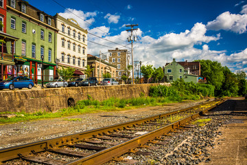 Fototapeta premium Railroad tracks and buildings on Main Street in Phillipsburg, Ne