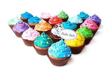 Delicious cupcakes with inscription isolated on white