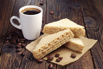 Cup of coffee and sweet waffles
