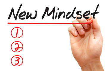 Hand writing New Mindset List with red marker