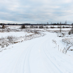 Fototapeta na wymiar country snowy road in winter