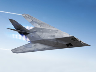 Fototapeta na wymiar Stealth aircraft streaking through the sky